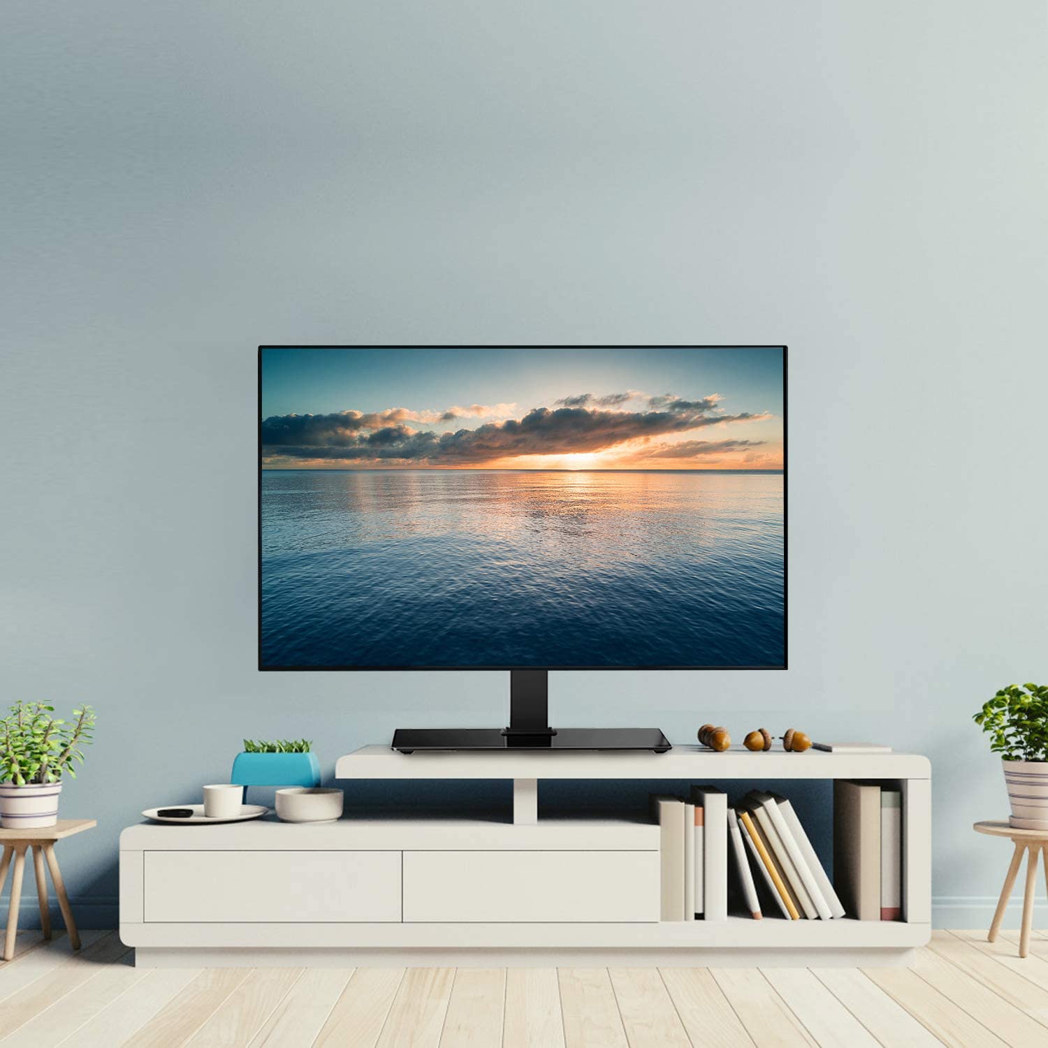 TV stand mount places a tv on the tabletop without drilling hole on the wall